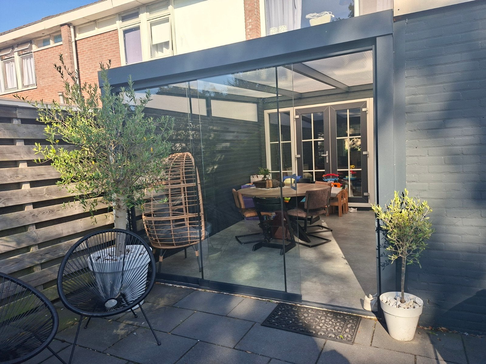Foto 9 van Moderne Veranda/Tuinkamer met Glazen Schuifwanden