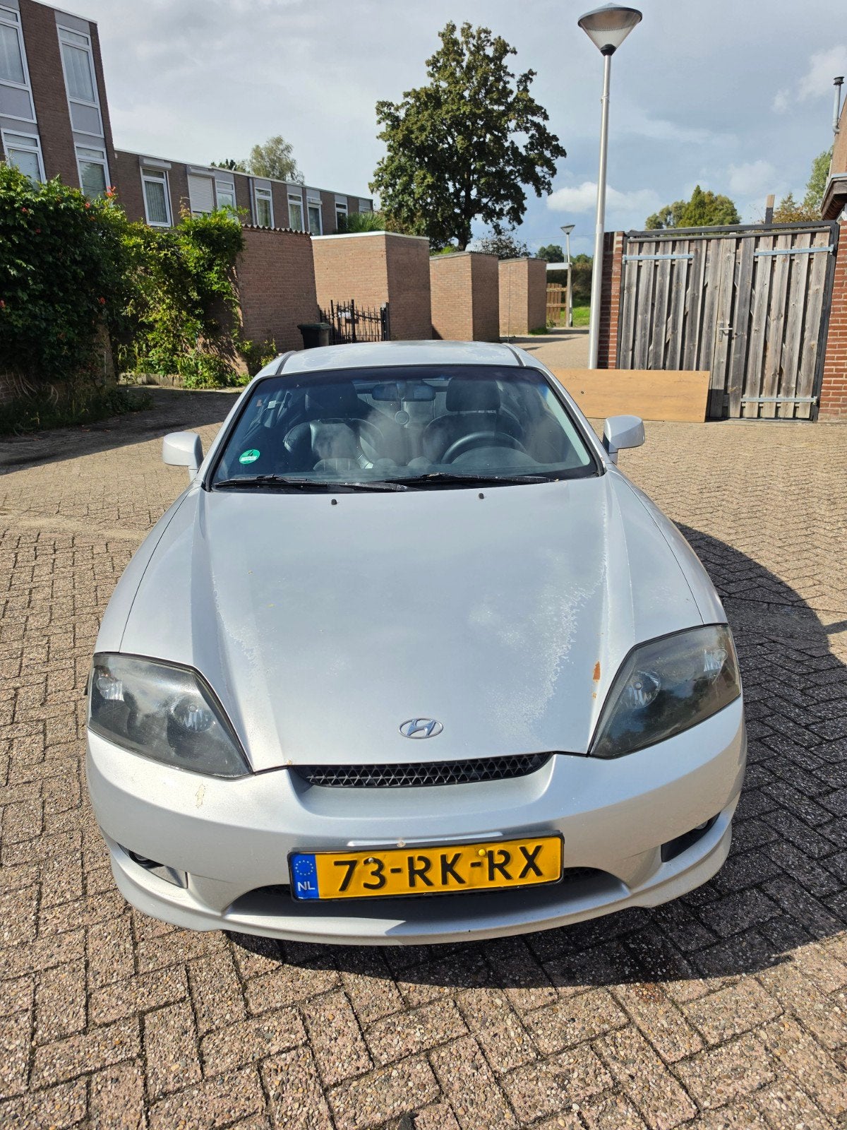 Hyundai Coupé 2.0 2005 Grijs, Auto's, 1282 kg, Zwart, 4 stoelen, Handgeschakeld