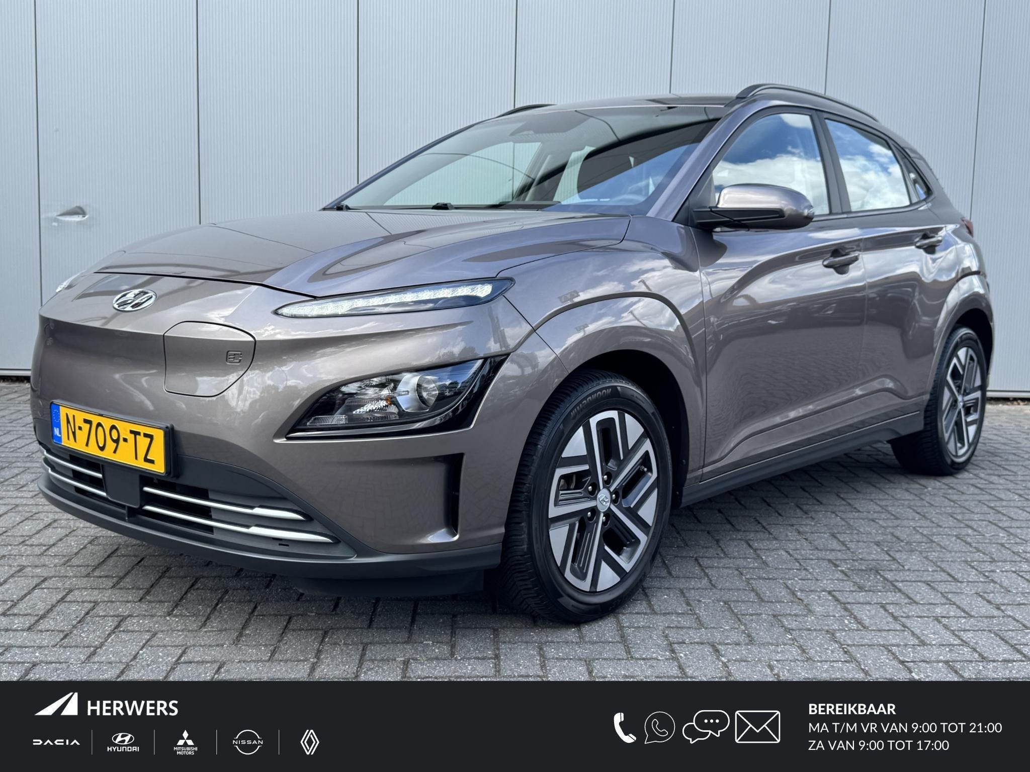 Hyundai Kona EV Comfort 64 kWh / Warmtepomp / SOH 100% / Nav, Stof, Gebruikt, Bruin, Origineel Nederlands
