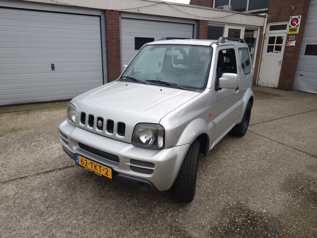 Suzuki Jimny 1.3 JLX Dealer onderhouden, Origineel NL met NA, Auto's, Keurmerk '100% Onderhouden', Euro 5, Zwart, 4 stoelen