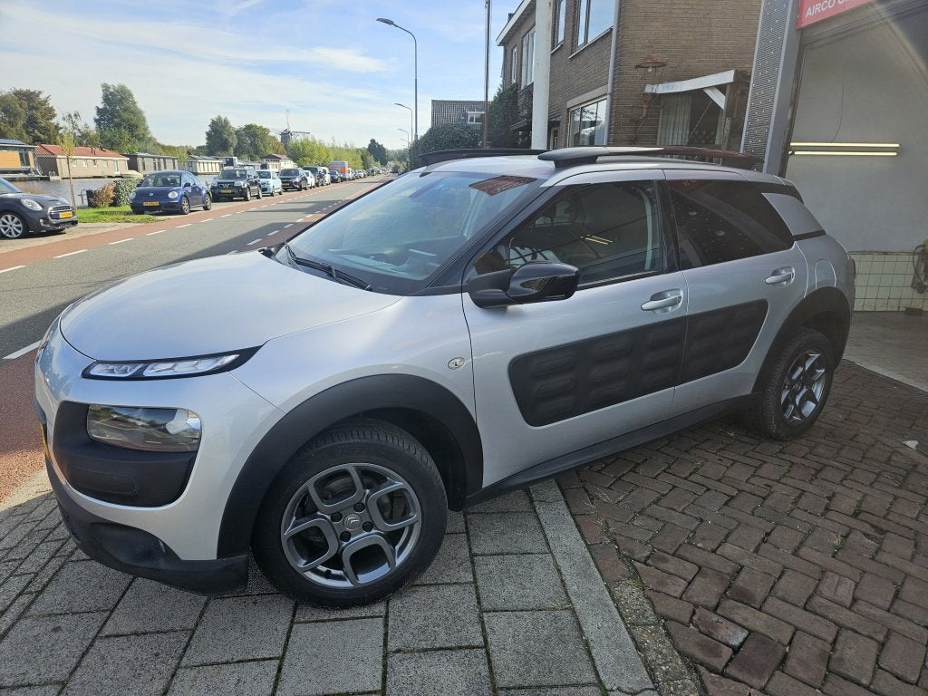 Citroën C4 Cactus 1.2 PureTech Shine (bj 2016), Auto's, Stof, Gebruikt, 1199 cc, 82 pk