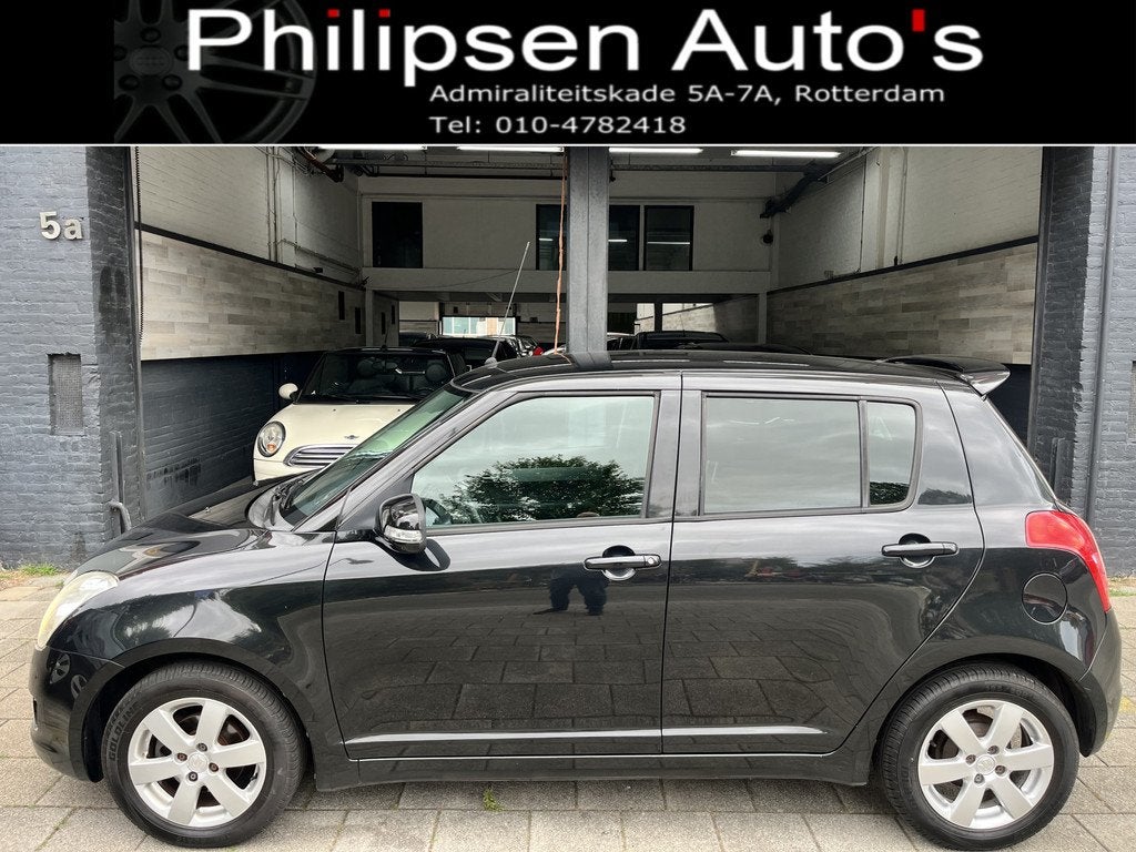 Suzuki Swift 1.3 Limited Airco L.M. (bj 2010), Voorwielaandrijving, Stof, Met garantie (alle), 400 kg