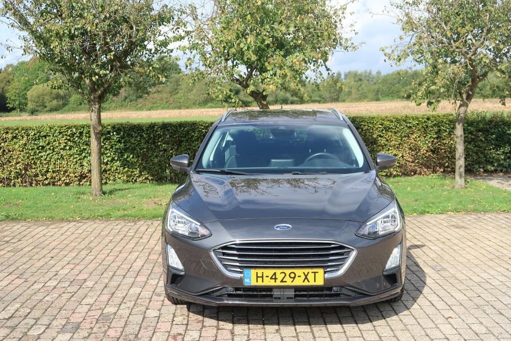 Ford Focus Wagon 1.0 EcoBoost Titanium Business, Gebruikt, Lichtsensor, Met garantie (alle), Origineel Nederlands