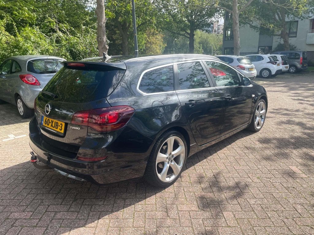 Opel Astra 1.4 Turbo 103KW Sports Tourer 2012 Zwart, Auto's, Voorwielaandrijving, 4 cilinders, Zwart, Origineel Nederlands