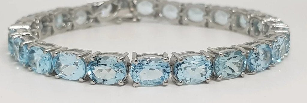 Zilveren tennis armband met topaas, Blauw, Ophalen of Verzenden, Zo goed als nieuw, Met edelsteen
