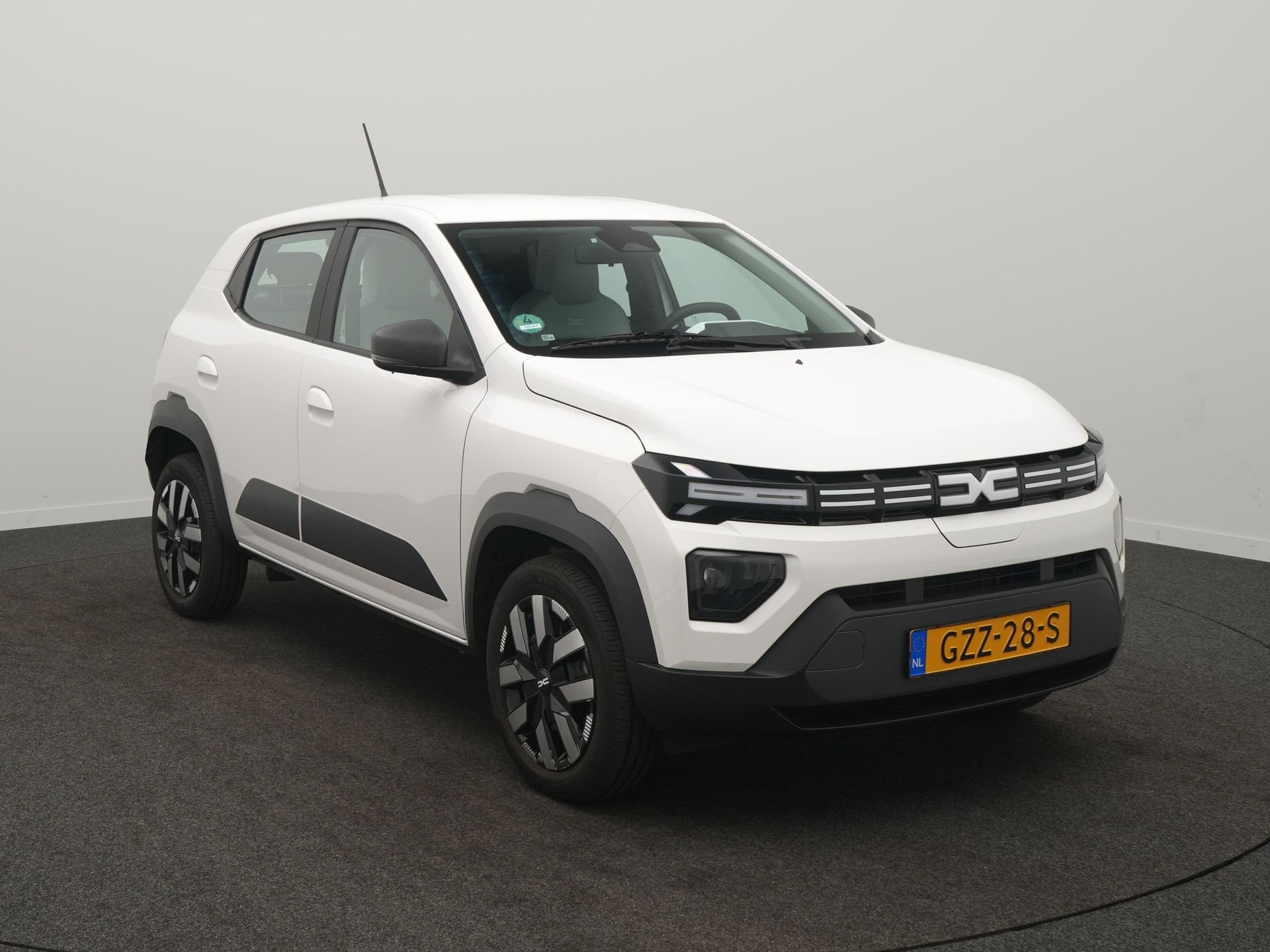 Dacia Spring Expression 65 26.8 kWh - DC Lader - 96,9% SoH -, Stof, Gebruikt, Zwart, 4 stoelen