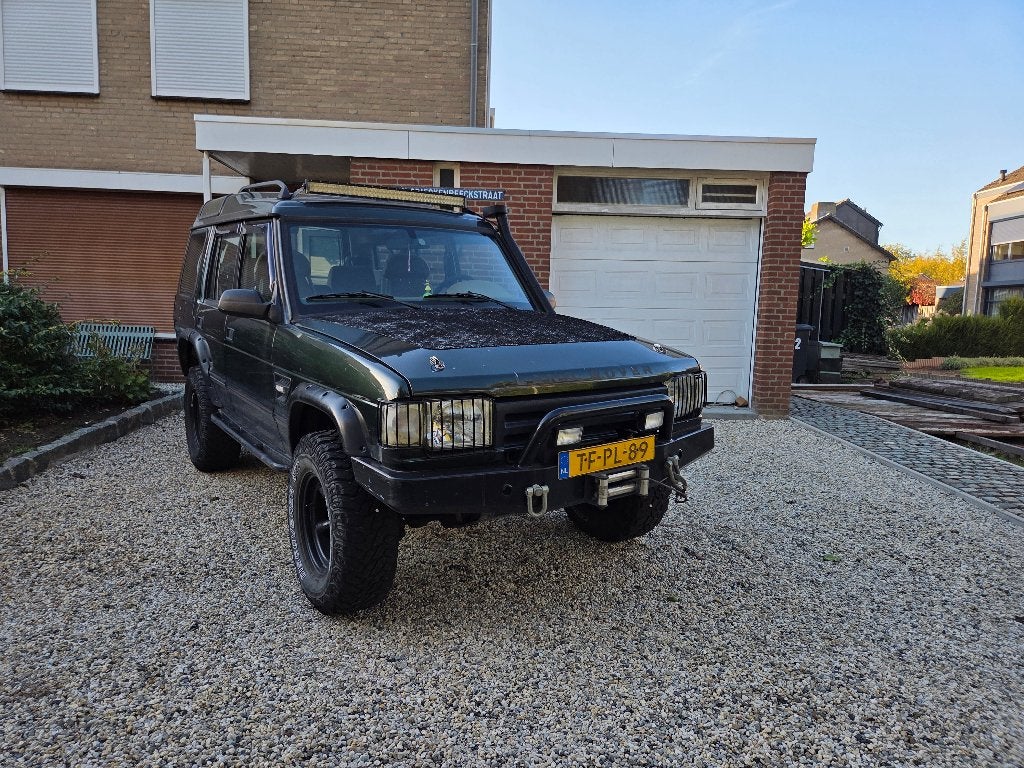 Land Rover Discovery 3.9 V8I AUT 4WD 1998 Groen, Auto's, Automaat, Stof, 7 stoelen, Origineel Nederlands