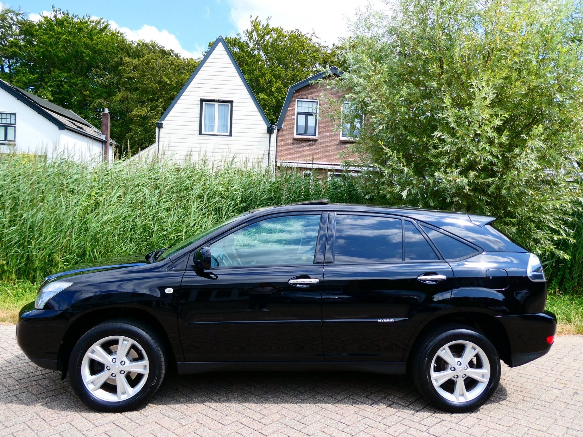 Lexus RX 400h 211pk Automaat Clima Leder Navi Schuifdak Xeno, Auto's, Automaat, 3311 cc, Gebruikt, Zwart
