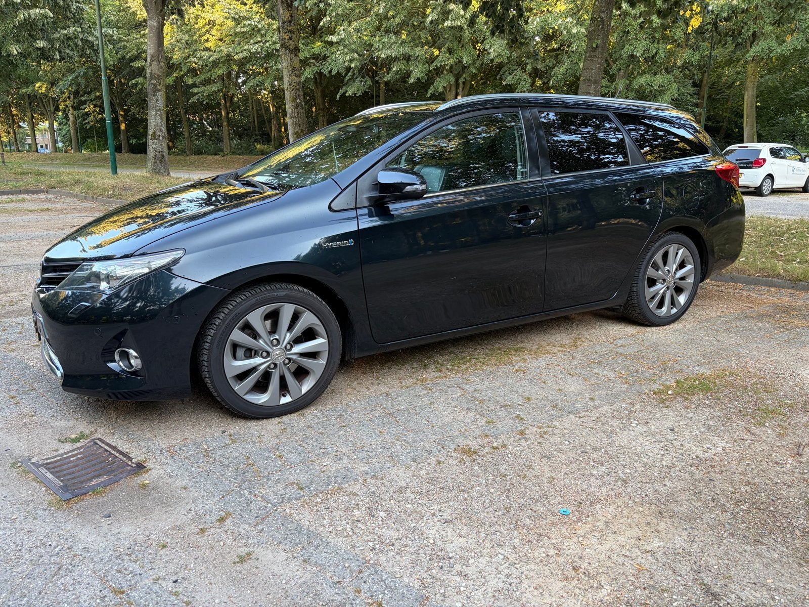 Toyota Auris 1.8 Hybrid Touring Sports Executive zwart/blauw, Auto's, Toyota, Zwart, Zwart, 25 km/l, Te koop