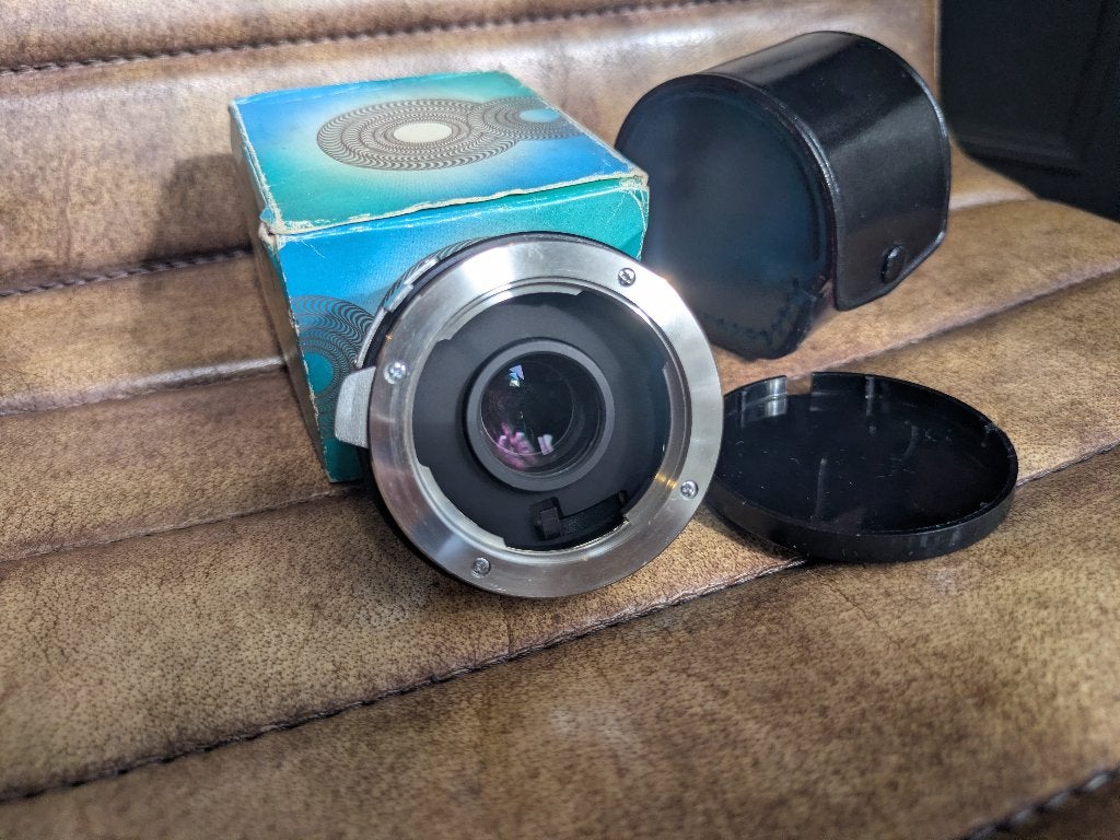 Hoya Teleconverter 2x voor Minolta SR/MC/MD mount. Compleet., Overige merken, Gebruikt, Beschermhoes/tas, Ophalen of Verzenden