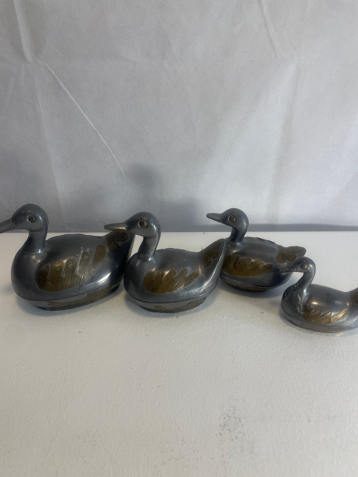 Set van 4 vintage tinnen eenden met messing accenten, Ophalen of Verzenden