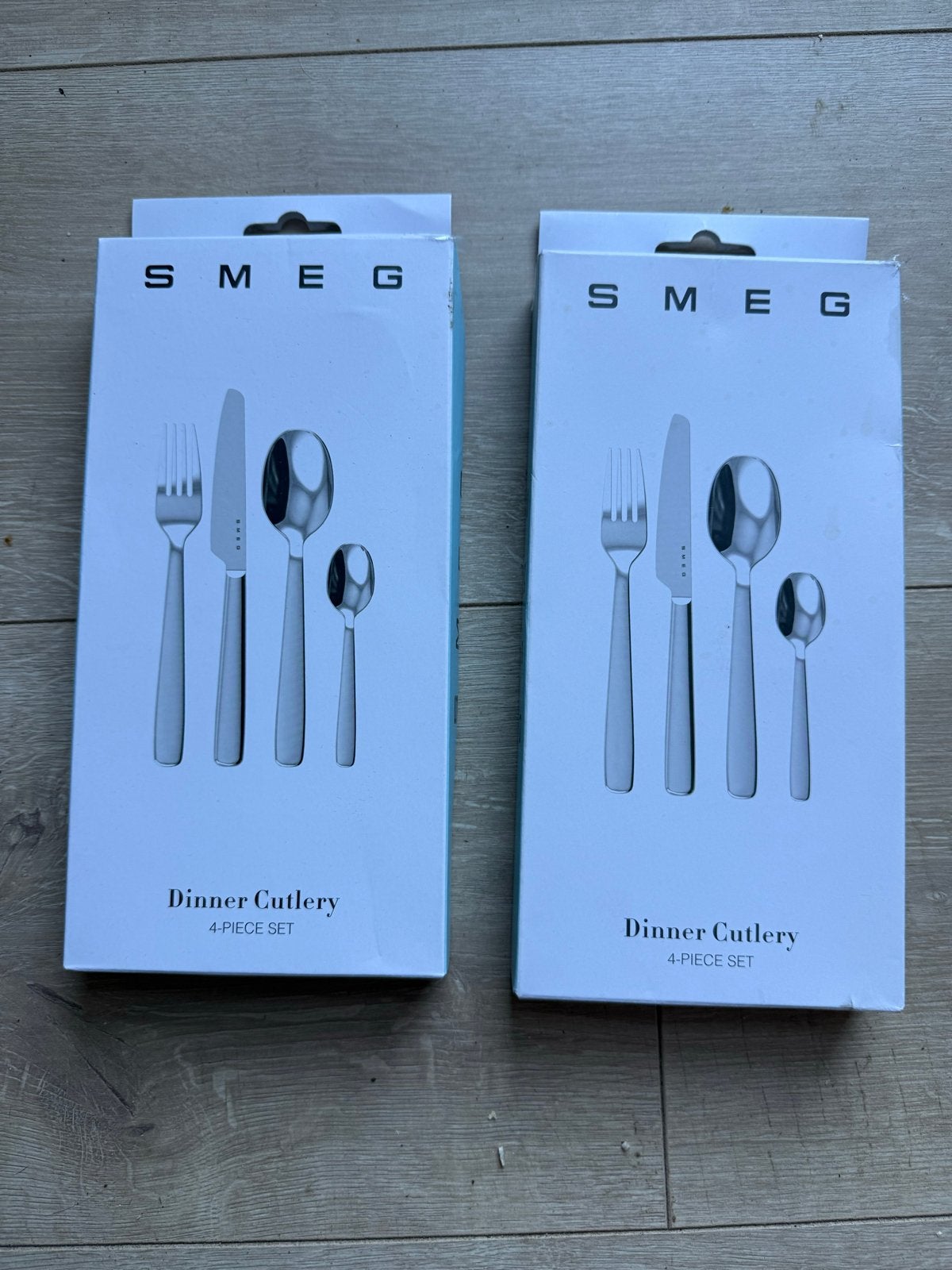 Smeg 4-delige bestekset (2 stuks), Ophalen of Verzenden, Nieuw, Rvs of Chroom, Bestekset