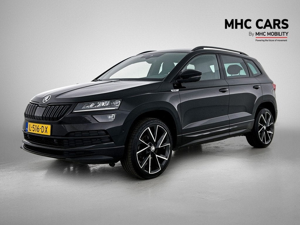 Skoda Karoq 1.5 TSI ACT Sportline Business | DSG | Comfort p, Auto's, Skoda, Stof, 4 cilinders, Automatische klimaatregeling, Zwart