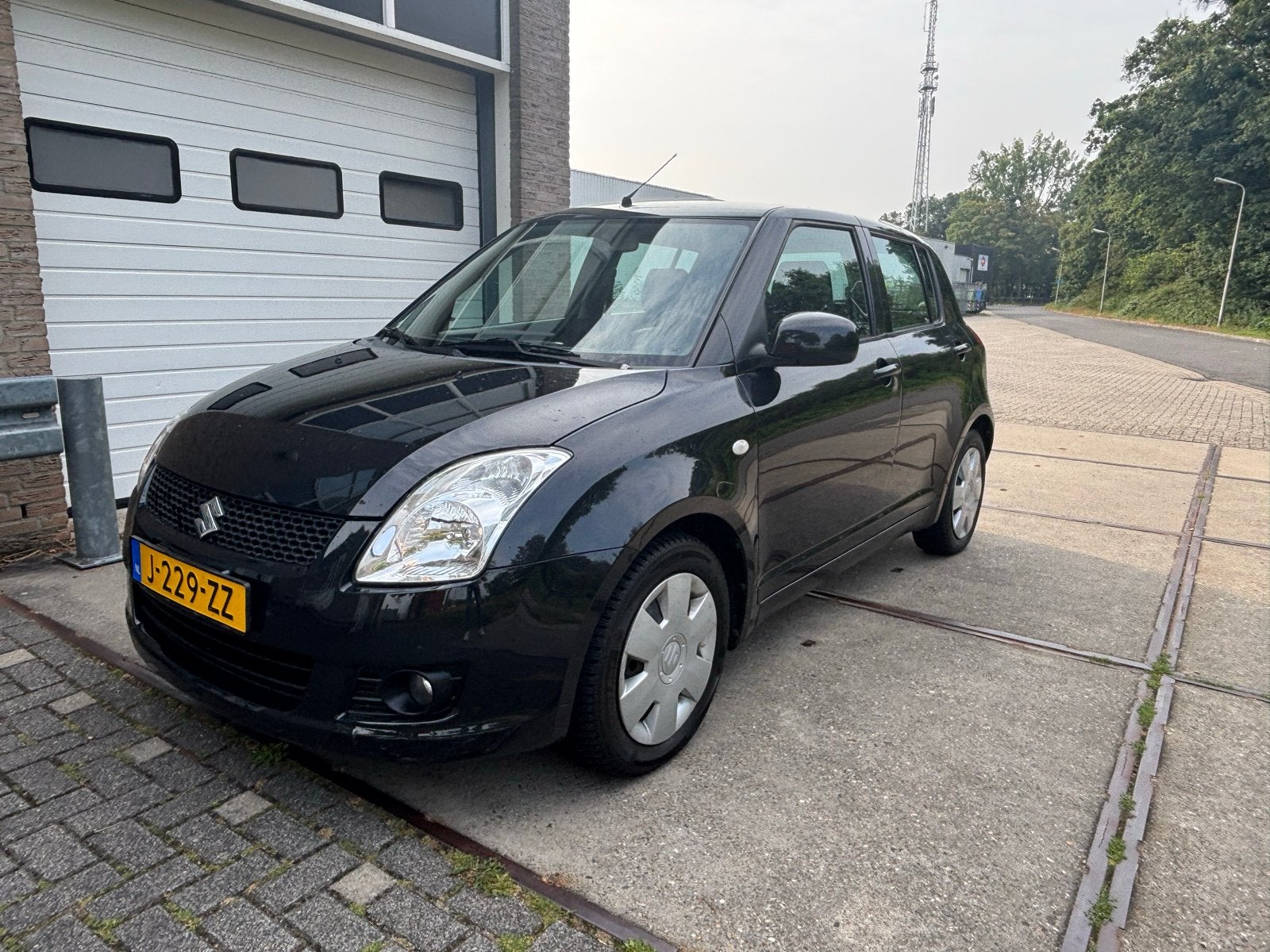 Suzuki Swift 1.3 5D 2009 Zwart, Auto's, Suzuki, Voorwielaandrijving, 40 €/maand, 400 kg, Handgeschakeld
