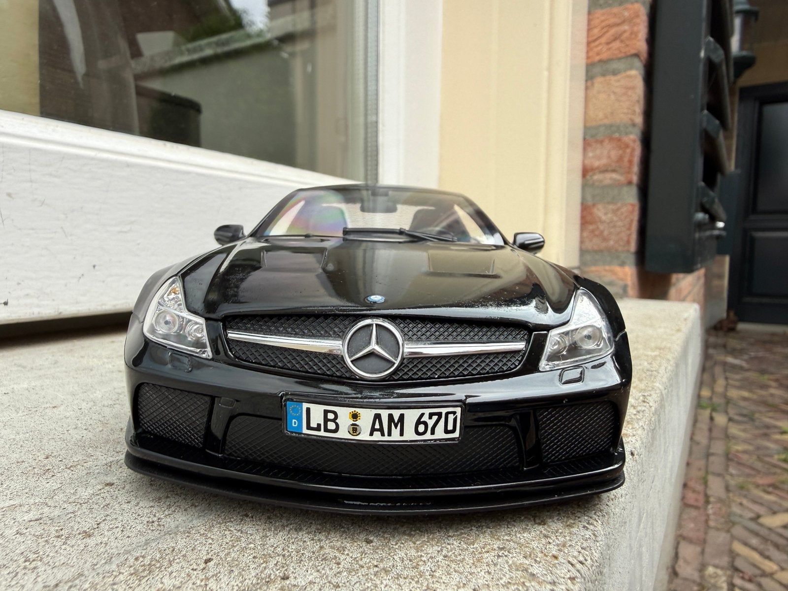 1:18 Mercedes R231 SL65 AMG Black Series 2009 Minichamps, Minichamps, Auto, Ophalen of Verzenden, Zo goed als nieuw