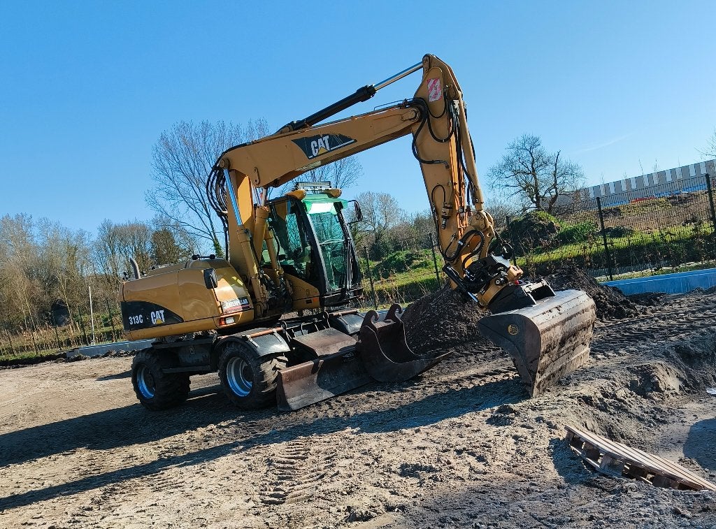 Caterpillar M313C met engcon draaikantelstuk, Ophalen, Graafmachine