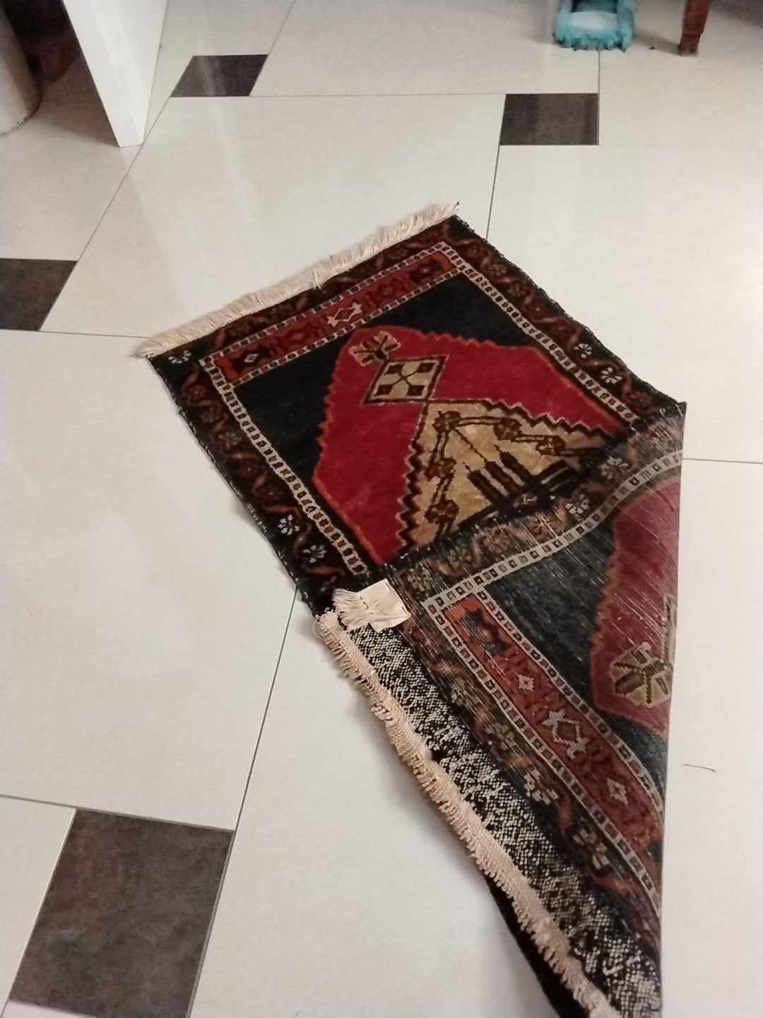 Perzische kleedje, Ophalen