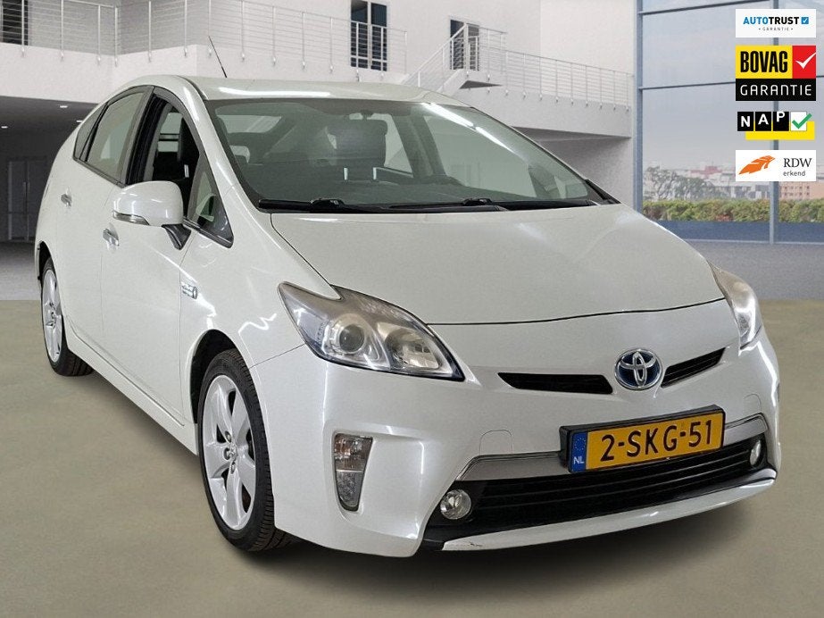 Toyota Prius 1.8 Plug-in Aspiration Automaat +NAP NL-auto, Auto's, Euro 5, Gebruikt, Leder en Stof, Wit