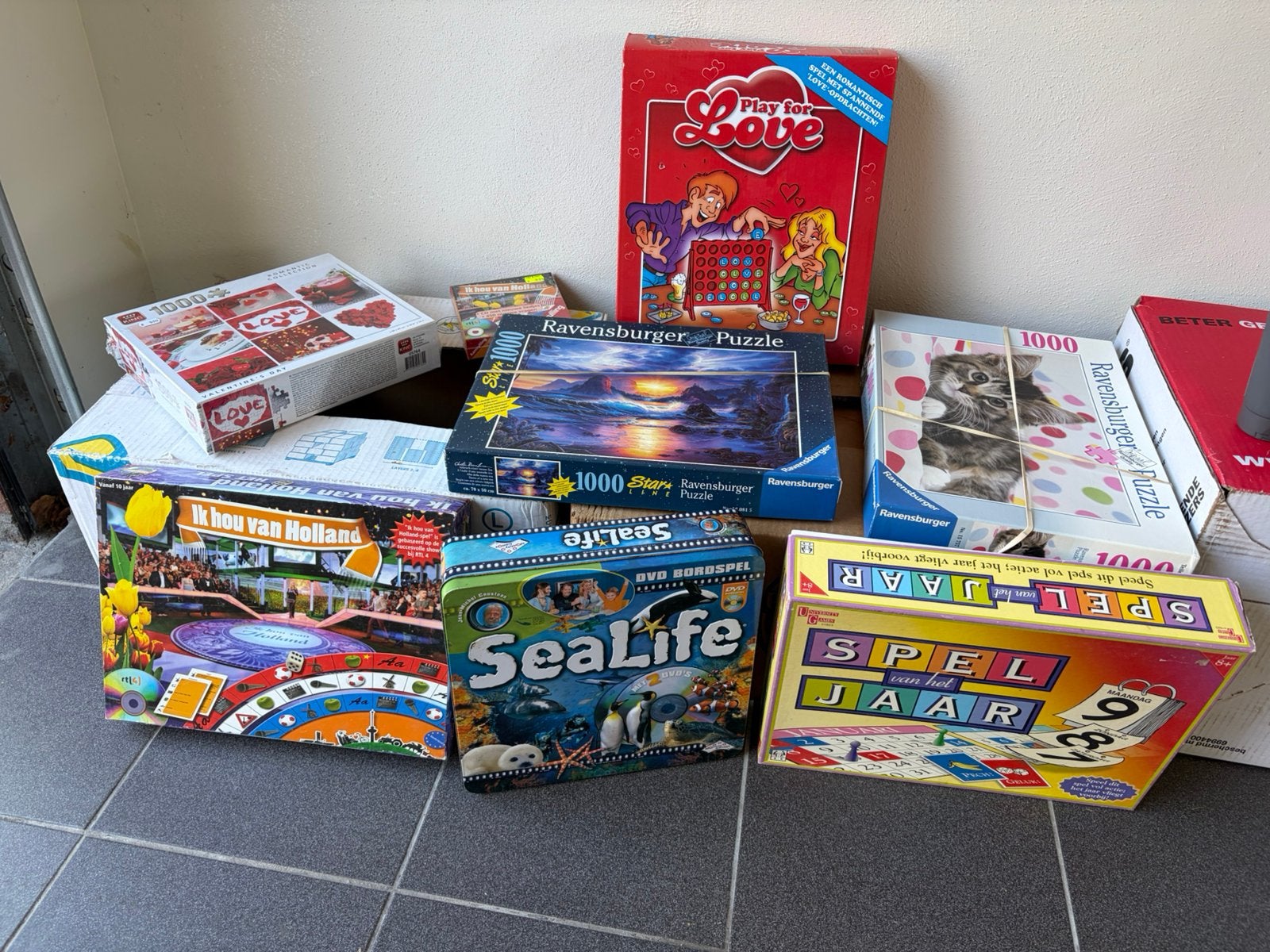 Partij puzzels en bordspellen Ravensburger 1000 stukjes e.a., Ophalen, Zo goed als nieuw
