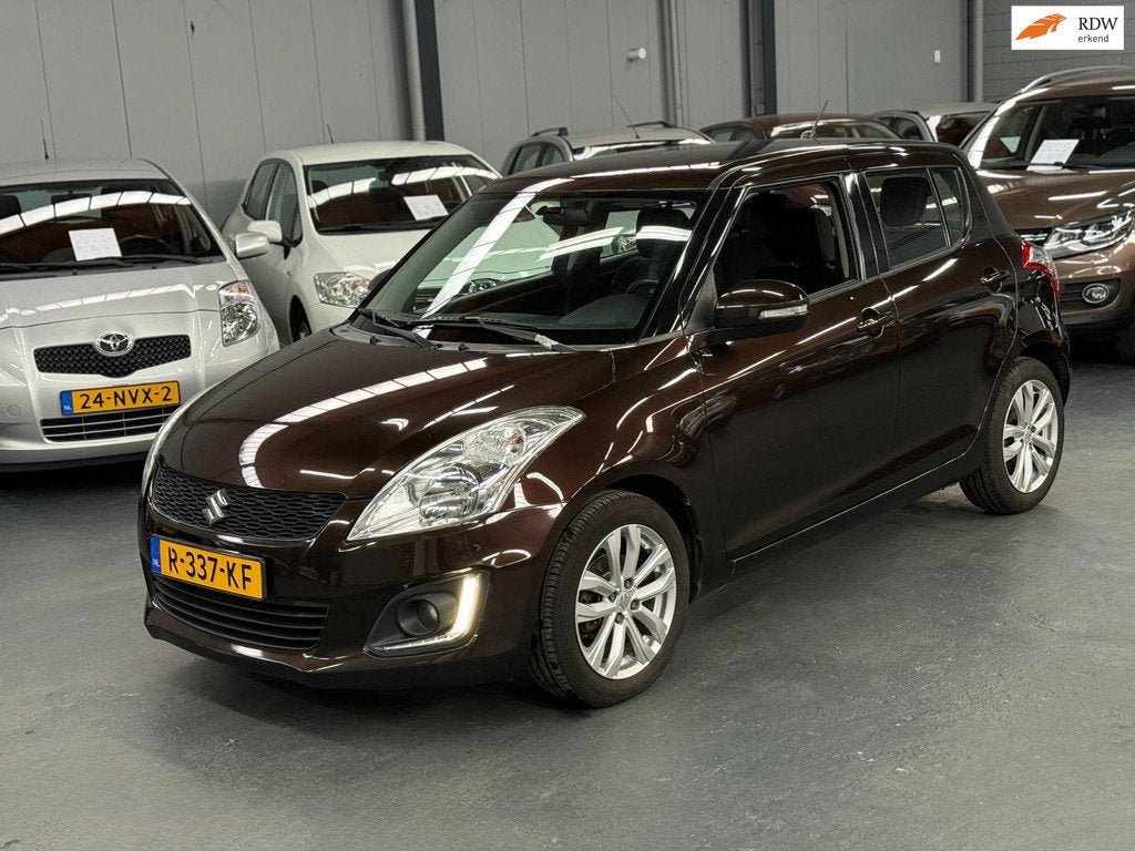 Suzuki Swift 1.2 Bandit EASSS Nieuwe APK Airco Cruise Contro, Voorwielaandrijving, Stof, Gebruikt, Bruin