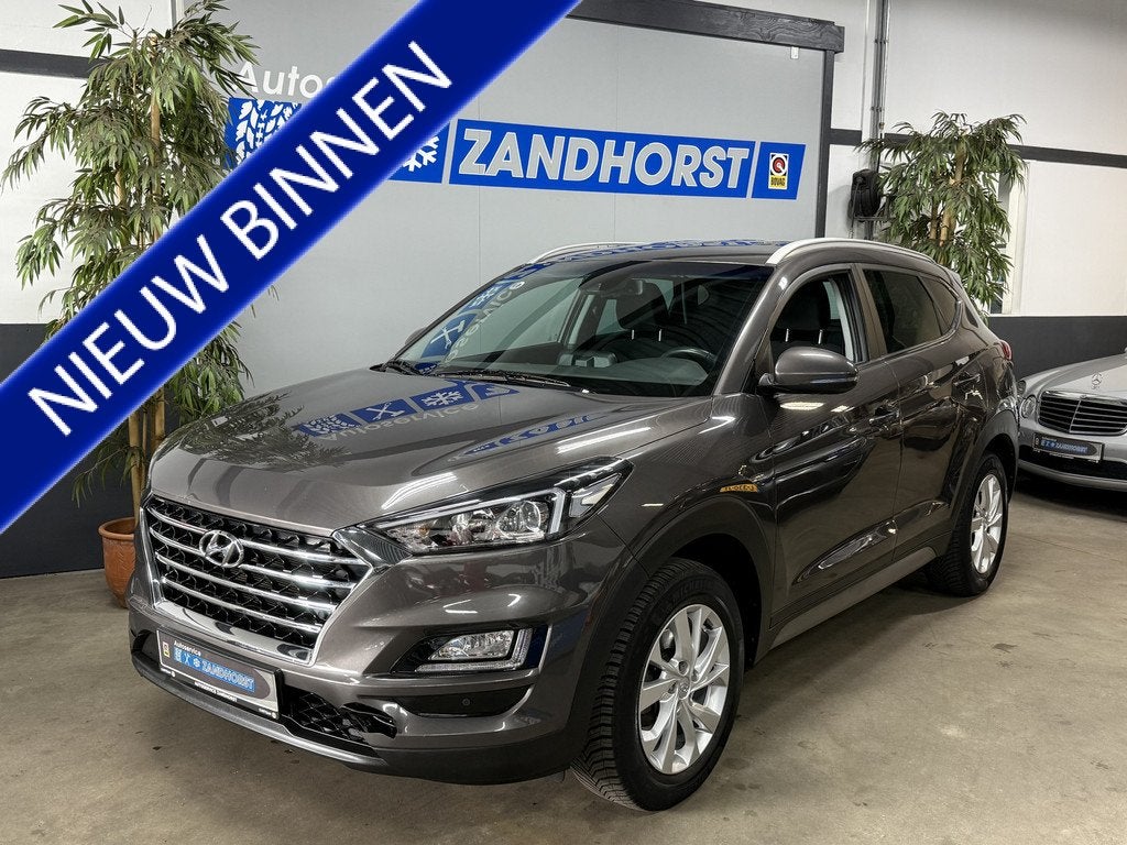 Hyundai Tucson 1.6 GDI Comfort // 17 inch // Camera // Stoel, Auto's, Hyundai, Gebruikt, 4 cilinders, Bruin, 132 pk
