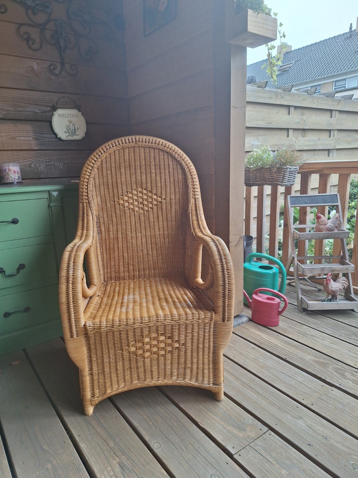 Rotan stoel met hoge rugleuning, Ophalen