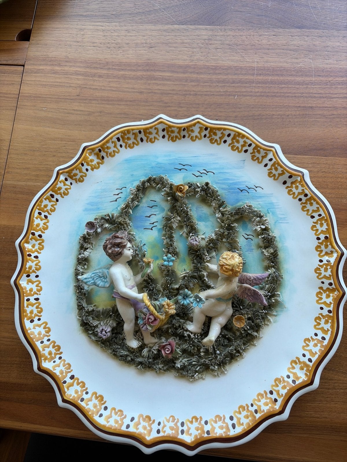 Decoratieve wandplaat met engelen en bloemen, Ophalen