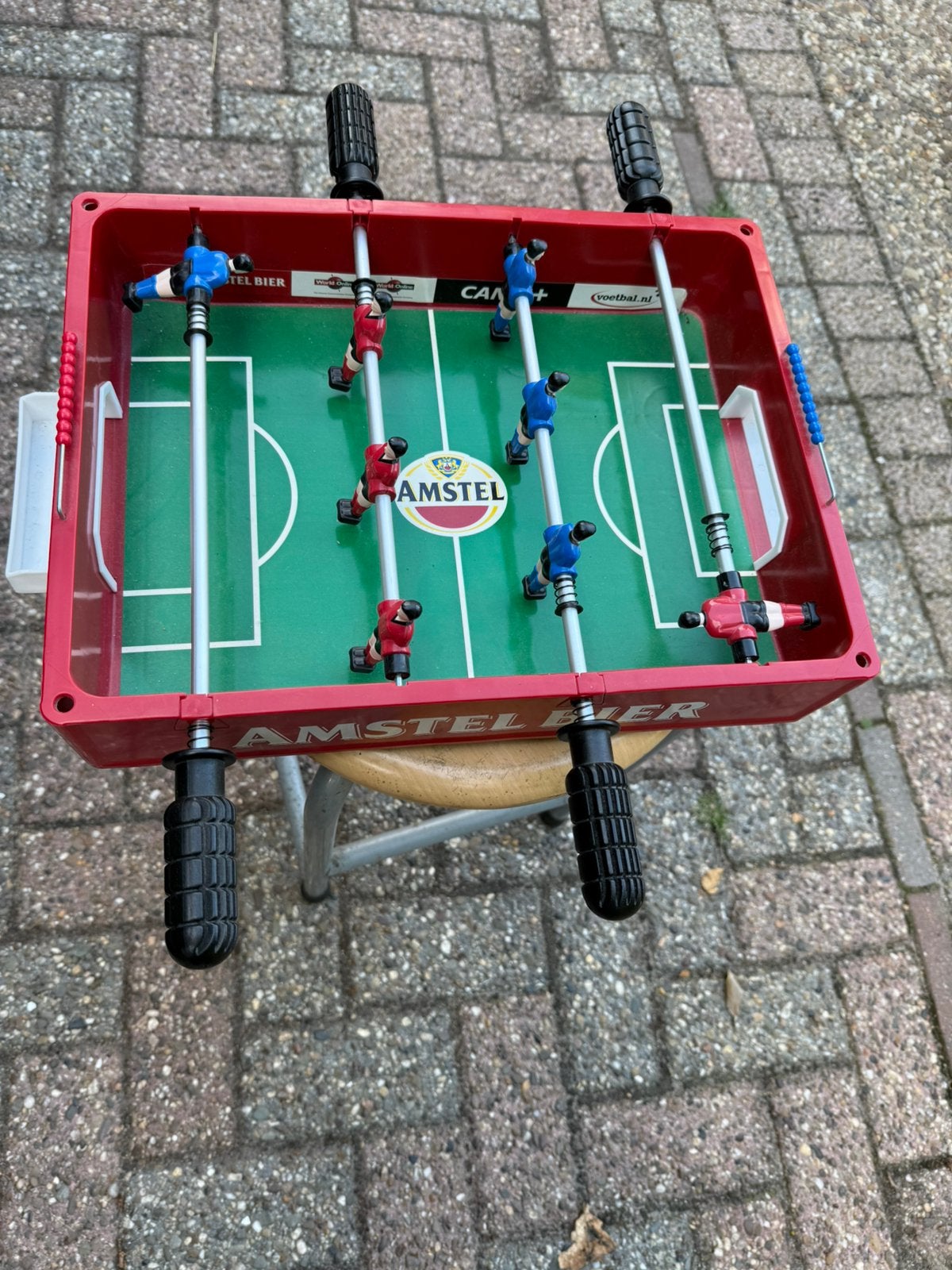 Voetbal spel van Amstel met bal, Ophalen, Zo goed als nieuw