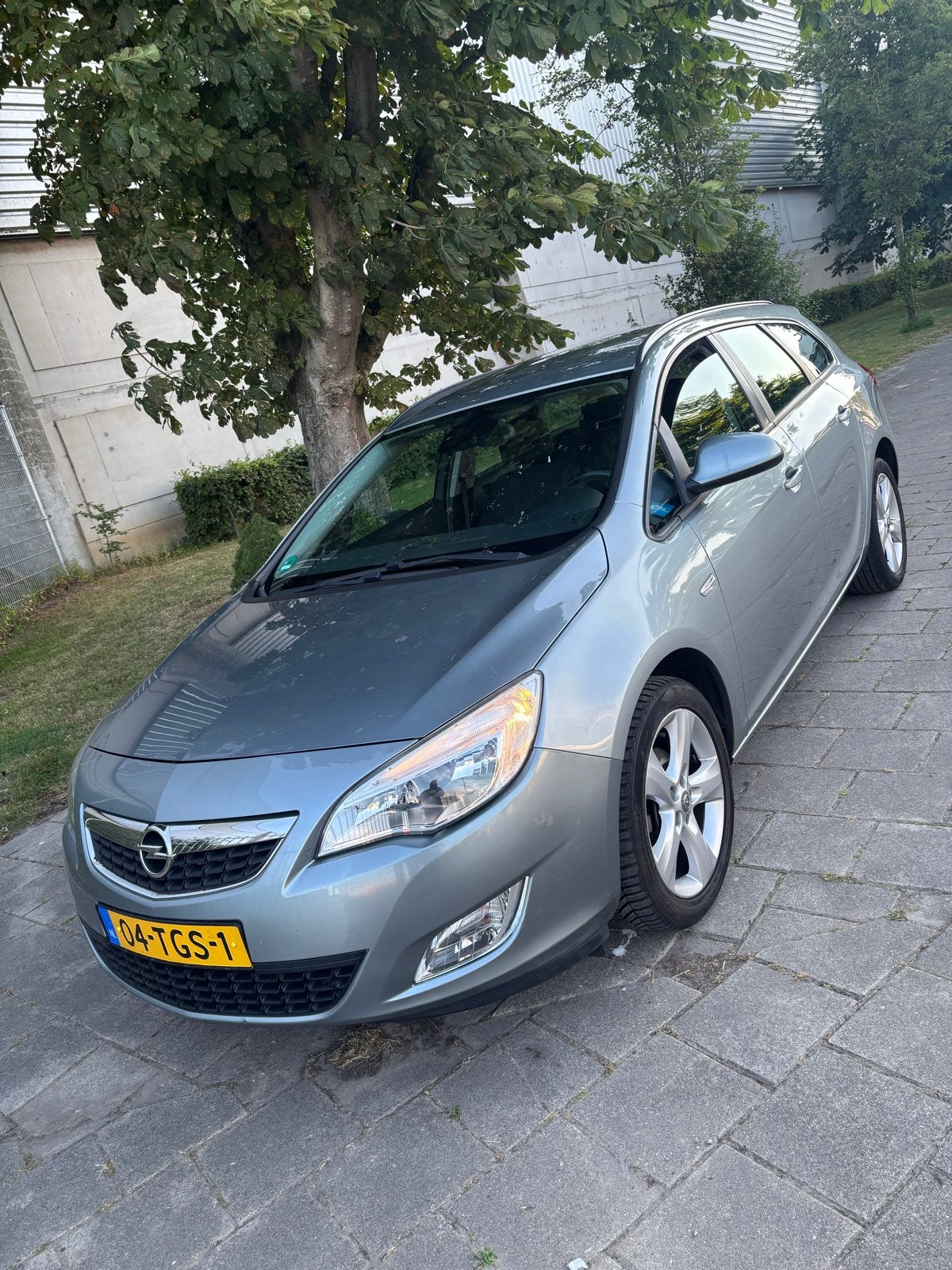 Opel Astra 1.4 Turbo 88KW Sports Tourer 2012 Grijs, Auto's, Voorwielaandrijving, 4 cilinders, 1337 kg, Origineel Nederlands