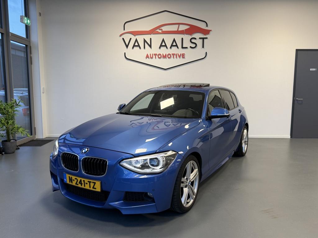 BMW 1-serie 116i High Executive M-Sport / Automaat/ Pano/ Ca, Gebruikt, Euro 6, 4 cilinders, Blauw