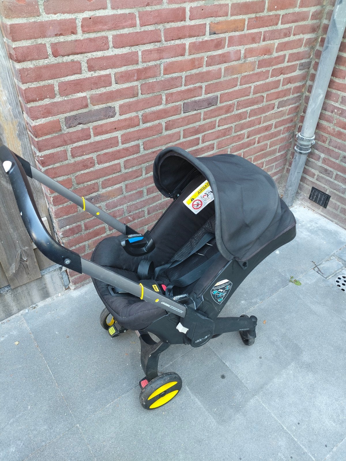 Doona autostoel/kinderwagen incl isofix, Ophalen of Verzenden, Gebruikt, Regenhoes
