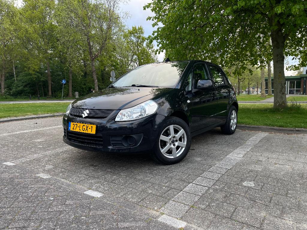 Suzuki SX4 1.6 AUT 2010 Zwart, Stof, 4 cilinders, 1200 kg, Grijs
