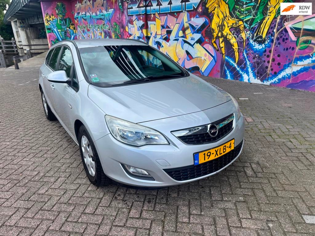 Opel Astra Sports Tourer 1.4 Turbo LPG Edition navigatie air, Voorwielaandrijving, Euro 5, Stof, Gebruikt