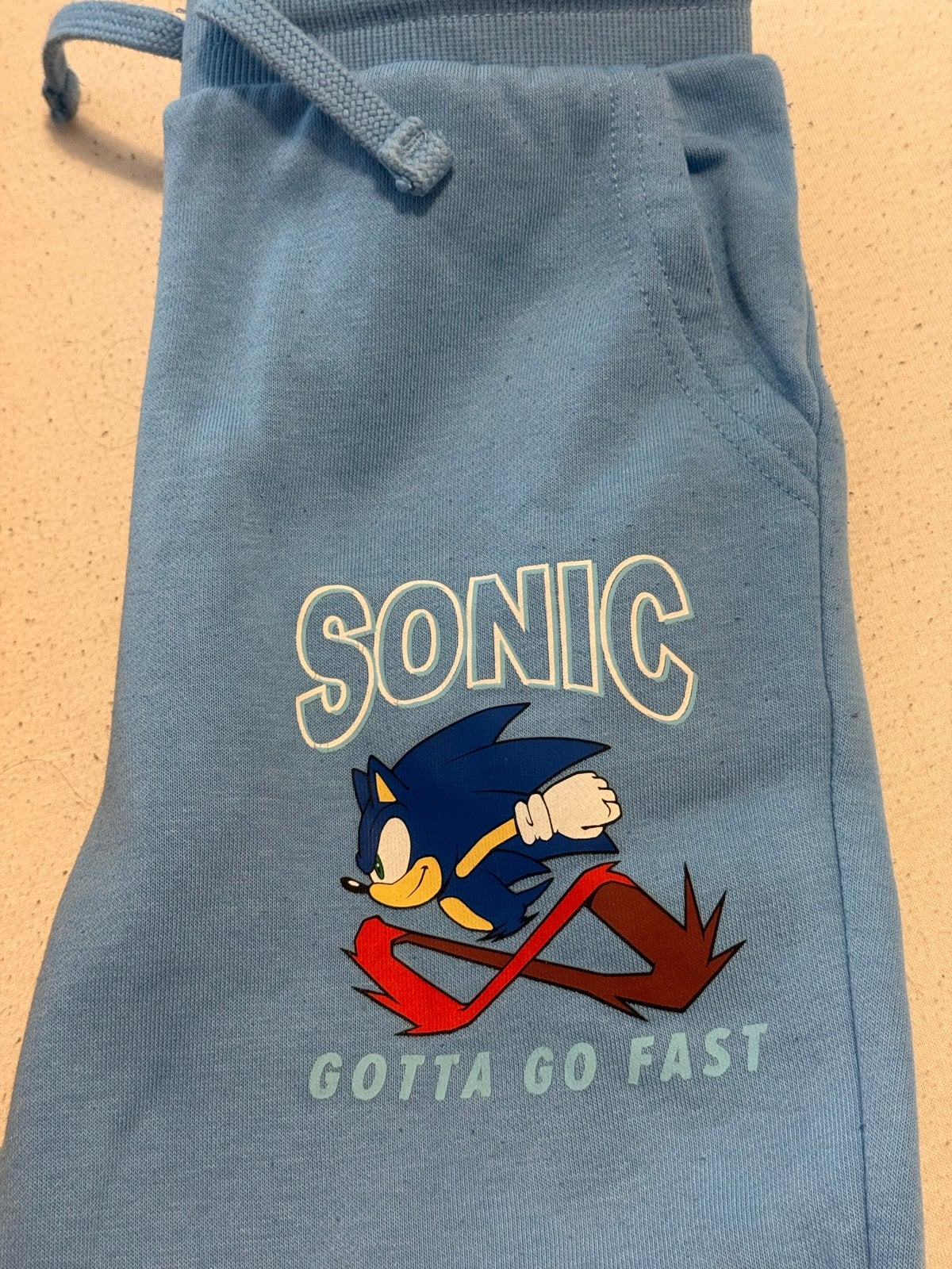 Sonic the Hedgehog joggingbroek - lichtblauw - maat 122, Ophalen of Verzenden, Gebruikt, Jongen, Broek