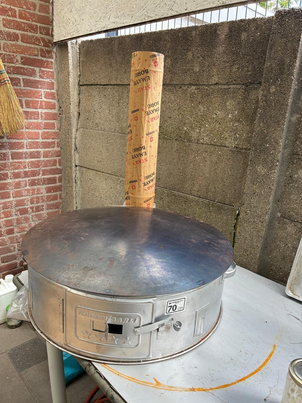 Houtvuur bakplaat, Ophalen