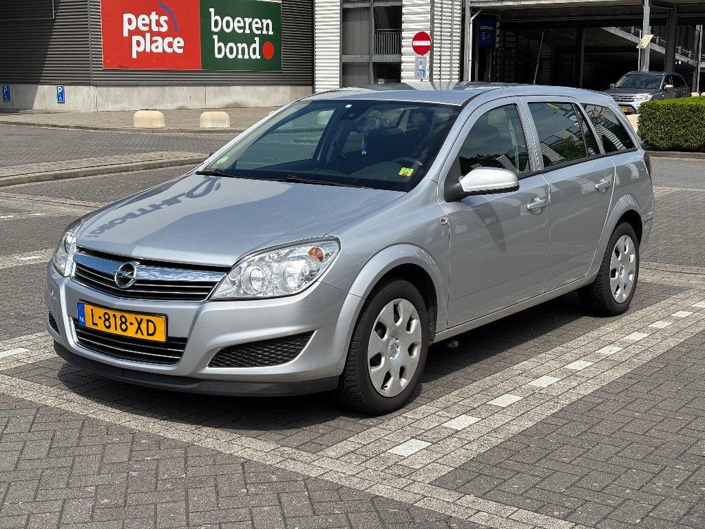 Opel Astra 1.4 16V St.wgn. 2009 Grijs, Auto's, Voorwielaandrijving, Stof, Stationwagon, Particulier
