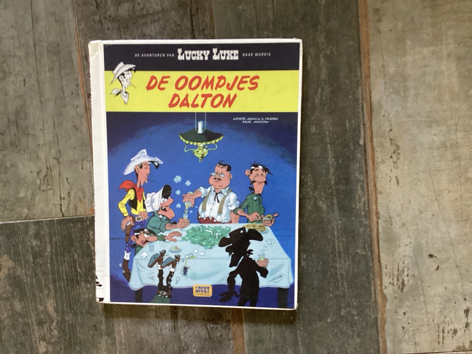 Lucky Luke - De Oompjes Dalton (Gelezen bibliotheekex.), Eén stripboek, Ophalen of Verzenden, Gelezen