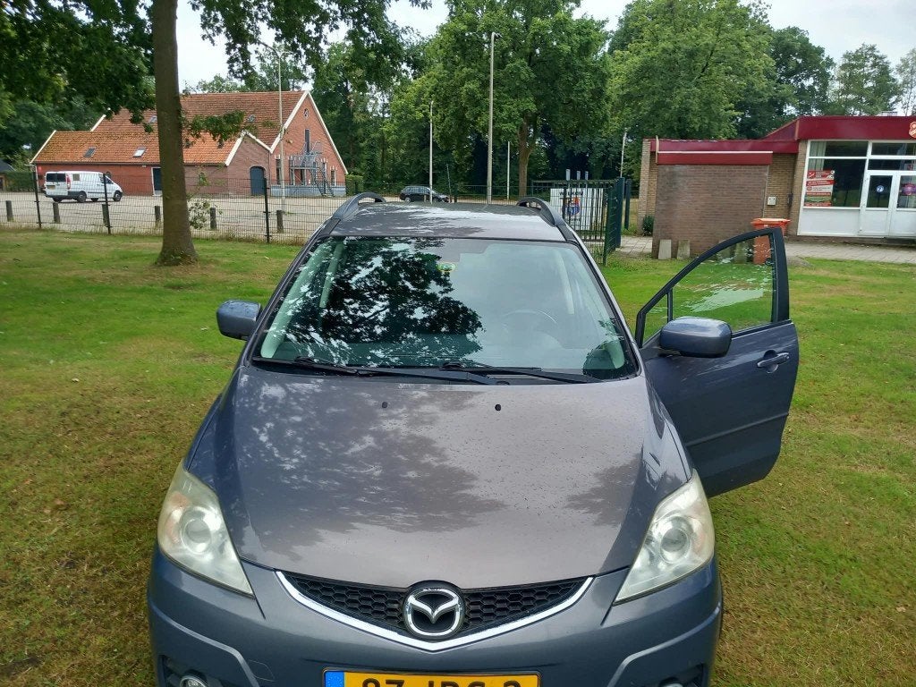 Mazda 5 1.8 2009 Grijs, Auto's, Mazda, 4 cilinders, 7 stoelen, Origineel Nederlands, Handgeschakeld