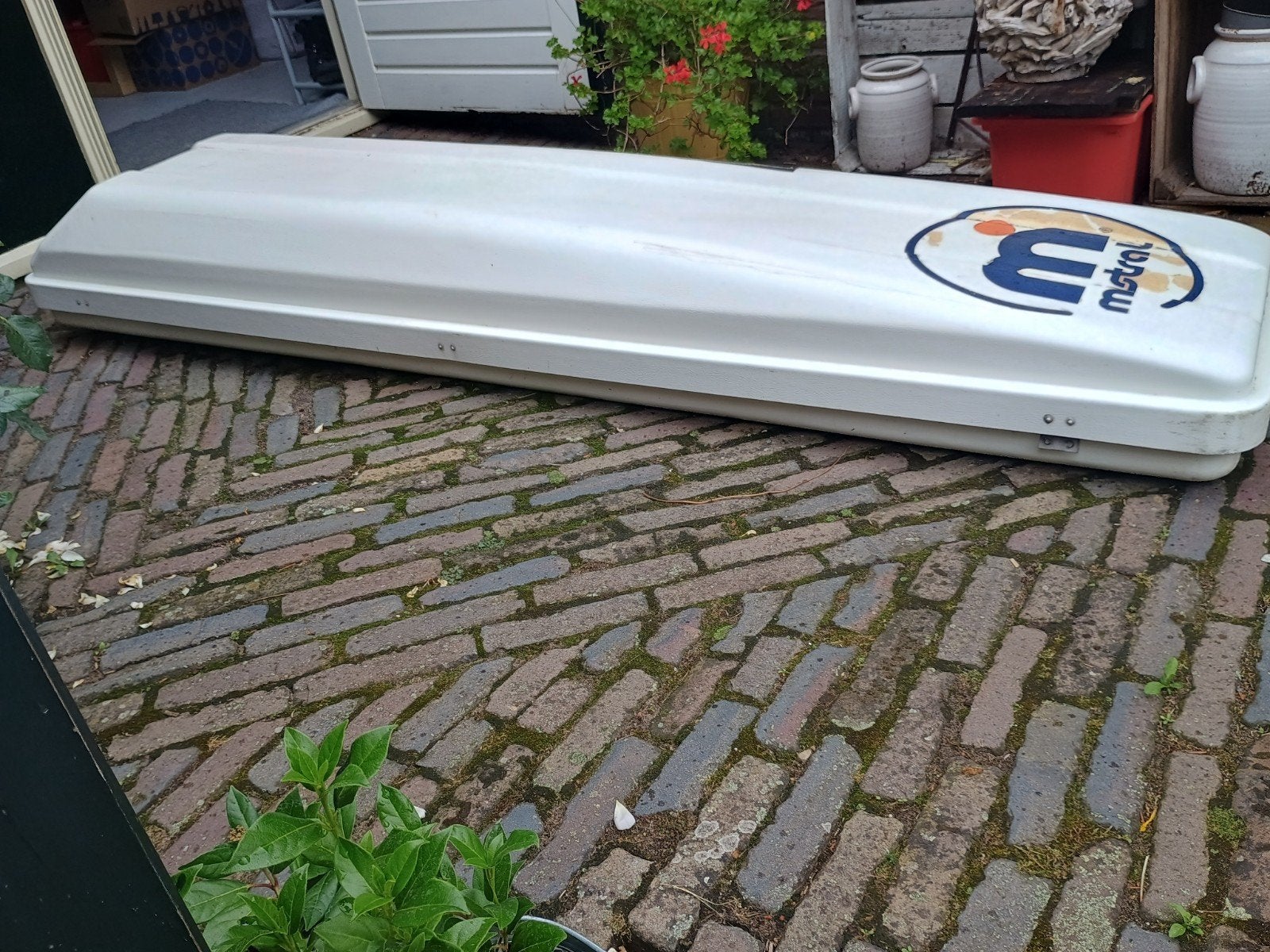 dakkoffer voor surfplank of ski's, Ophalen