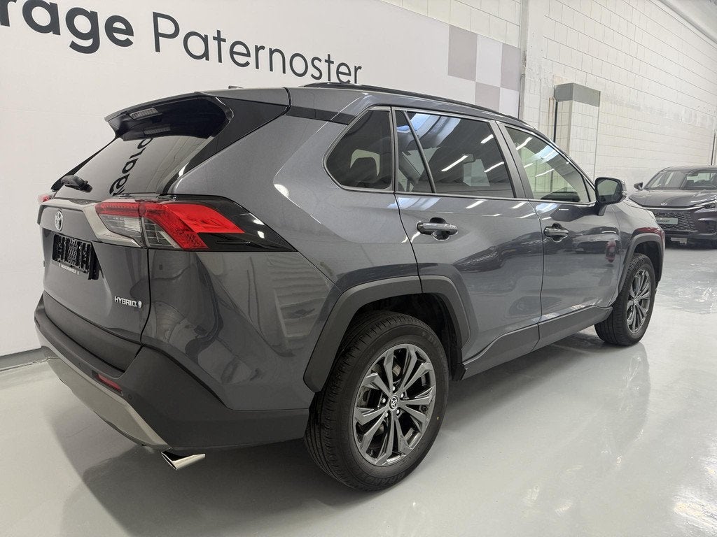 Toyota RAV4 2.5 Hybrid Leer / Carplay / Stoel & Stuurverwarm, Auto's, 12 maanden, Gebruikt, 4 cilinders, Bedrijf