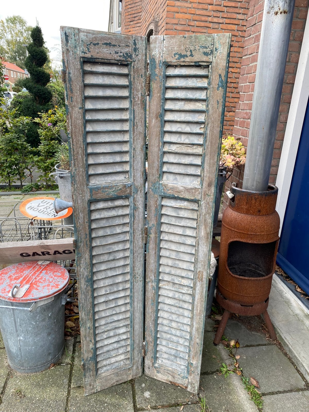 Twee houten luiken uit Frankrijk, Ophalen