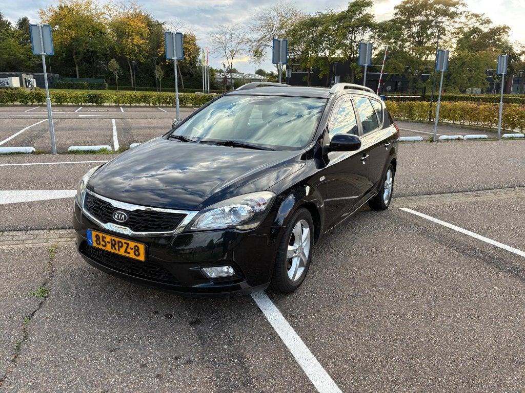 Kia (Pro) Cee d 1.4 Sporty Wagon 2012 Zwart, Auto's, Voorwielaandrijving, Stof, 4 cilinders, 1396 cc