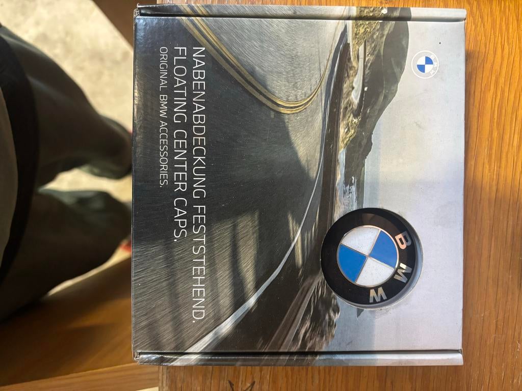 BMW Meedraaiende Naafdoppen 56mm - Nieuw in Doos, Auto diversen, Auto-accessoires, Nieuw, Ophalen of Verzenden