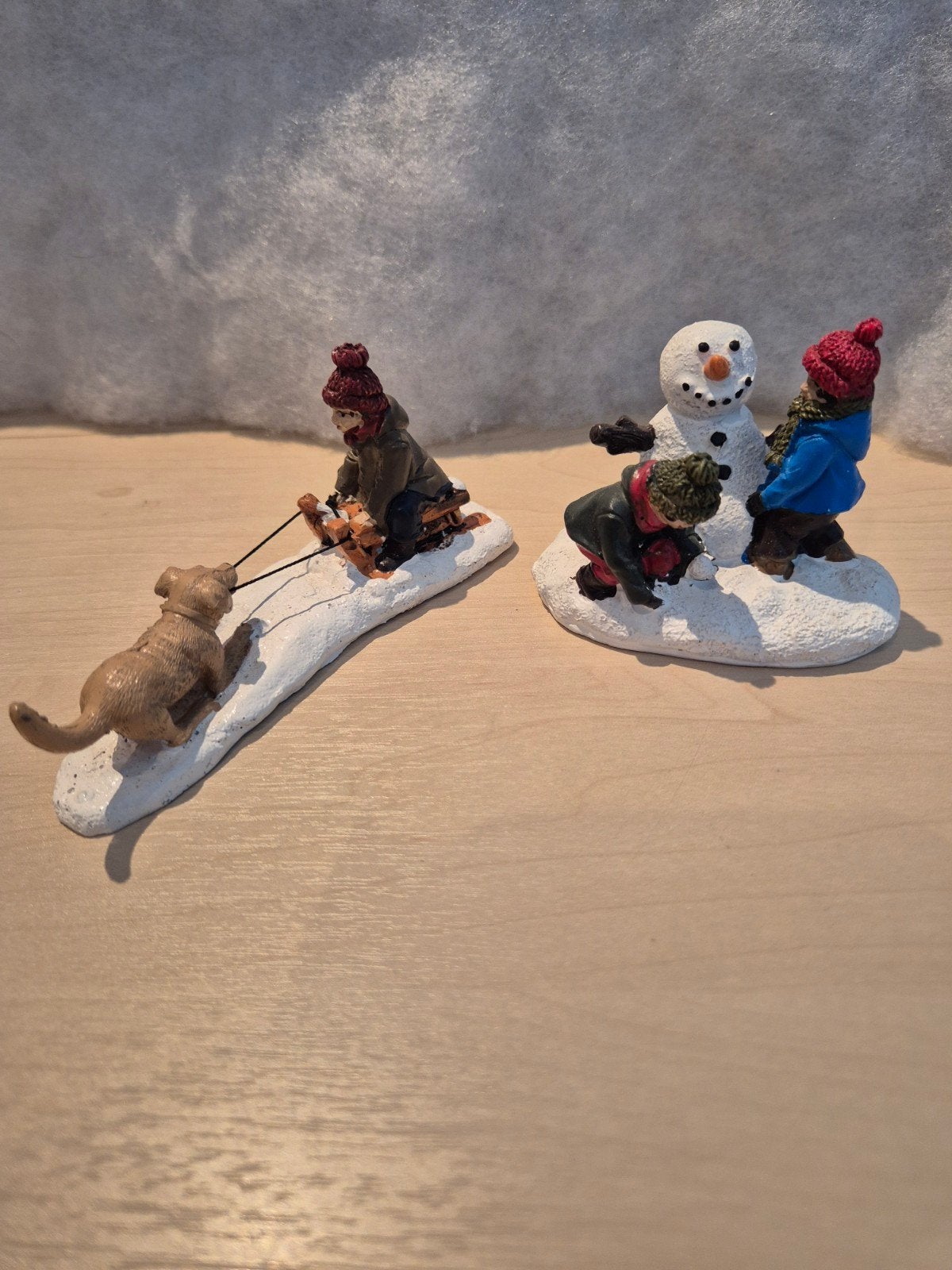 Sneeuwpret figuurtjes voor kerstdorp, Ophalen