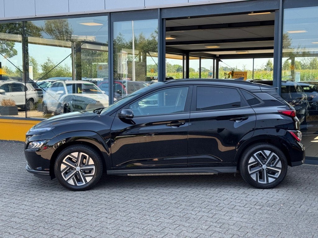 Hyundai Kona EV 64kWh Premium - Navi - camera - stoel/stuur, 12 maanden, 14 kWh, Gebruikt, Zwart