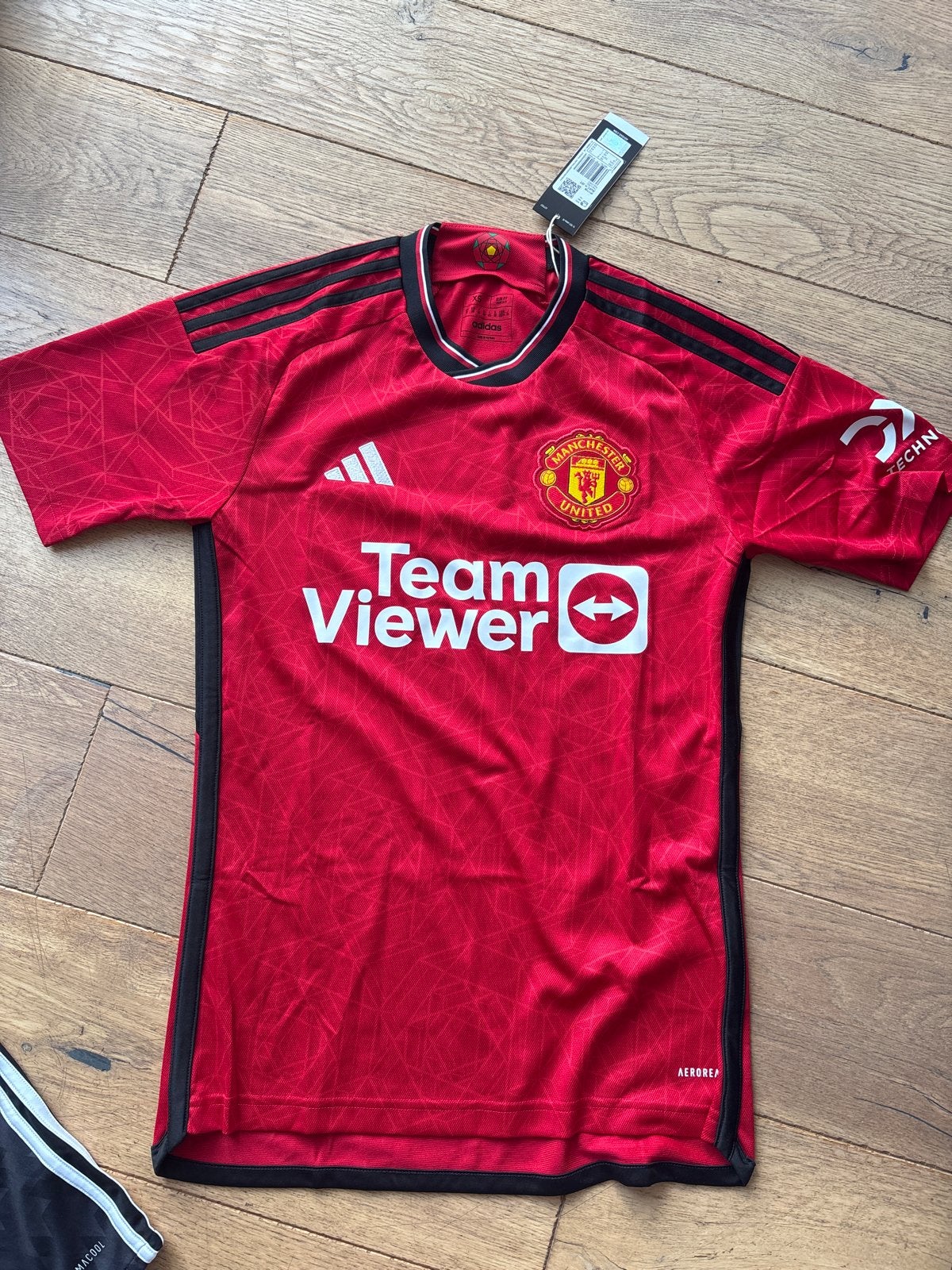 23/24 Manchester United Thuisshirt Maat XS Nieuw, Nieuw, Ophalen of Verzenden, Voetbal, Rood