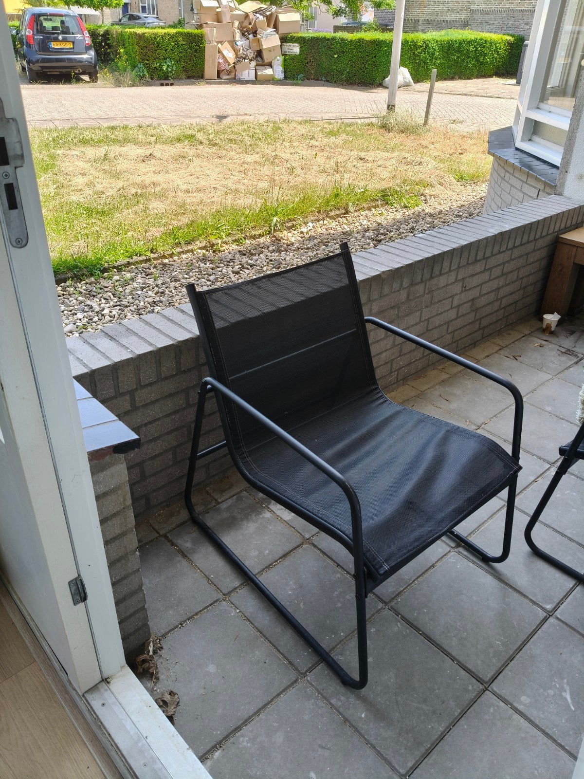Zwarte tuinstoel met metalen frame, Ophalen