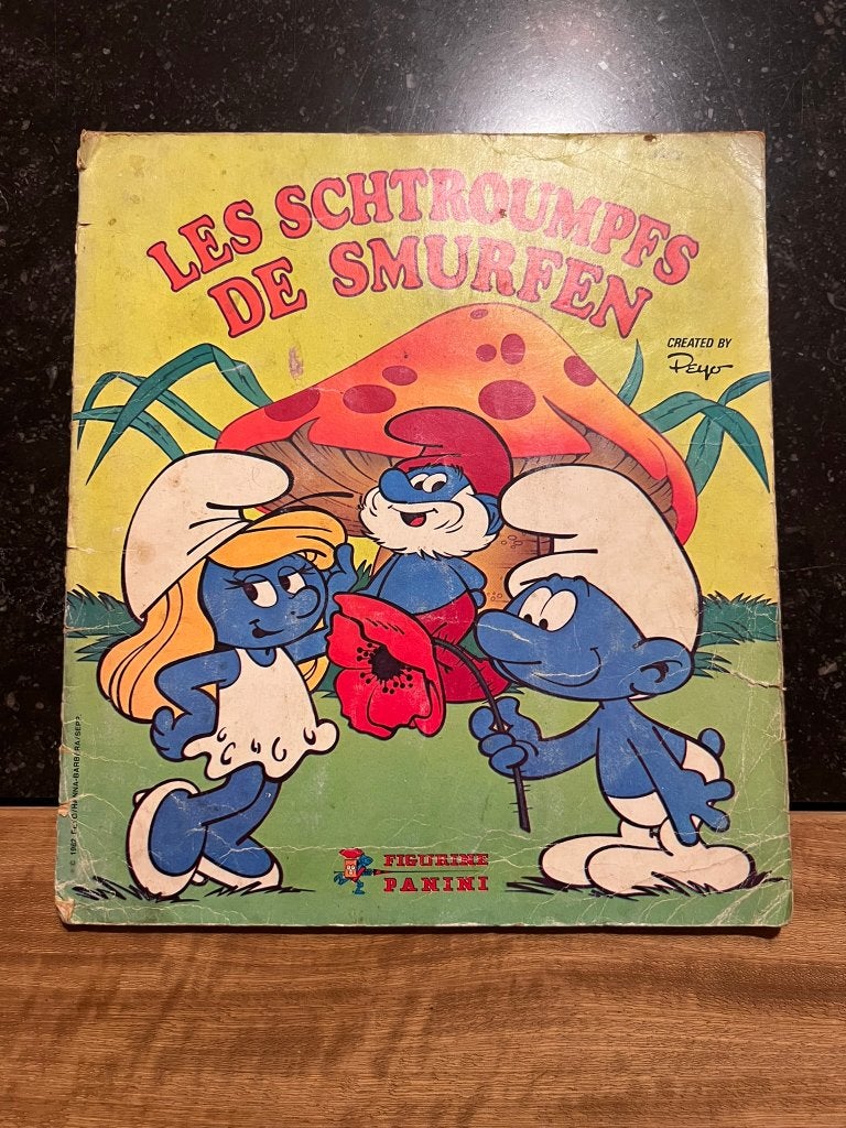 Panini boek: De Smurfen / LEs Schtroumpfs - Peyo, Ophalen of Verzenden, Gebruikt, Verschillende Smurfen, Overige typen