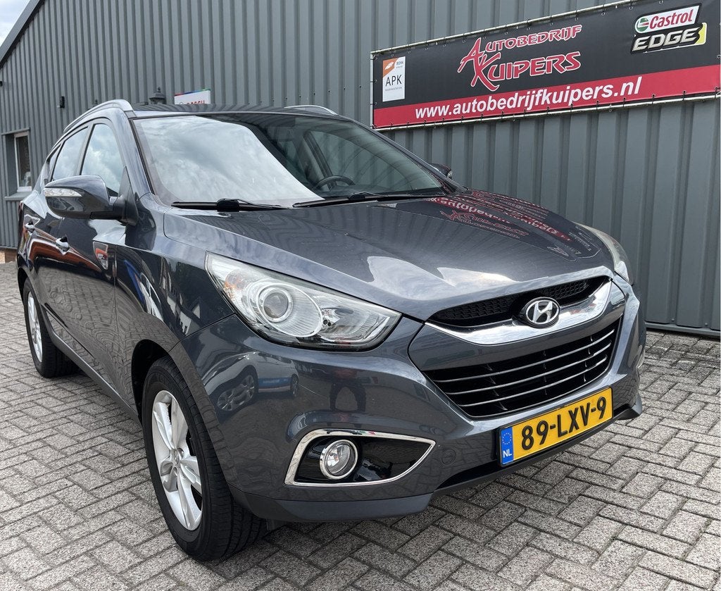 Hyundai ix35 2.0i Business Edition Clima.Navi.Cruise.Lm.velg, Auto's, Hyundai, Gebruikt, Zwart, 4 cilinders, Leder en Stof