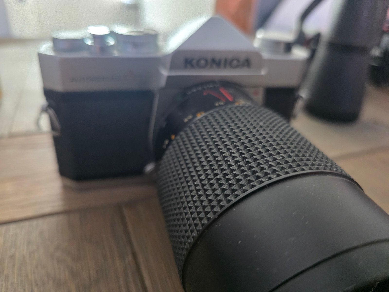 Konica Autoreflex A Spiegelreflexcamera met Hexanon Zoomlens, Ophalen of Verzenden